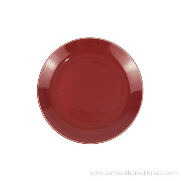 Reactive glazed stoneware dinner set in Claret-red